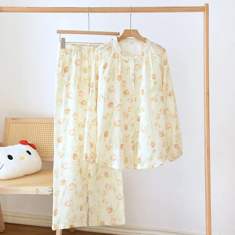 allvariants:: Light-colored garment with floral pattern hanging on a wooden rack against a white wall.