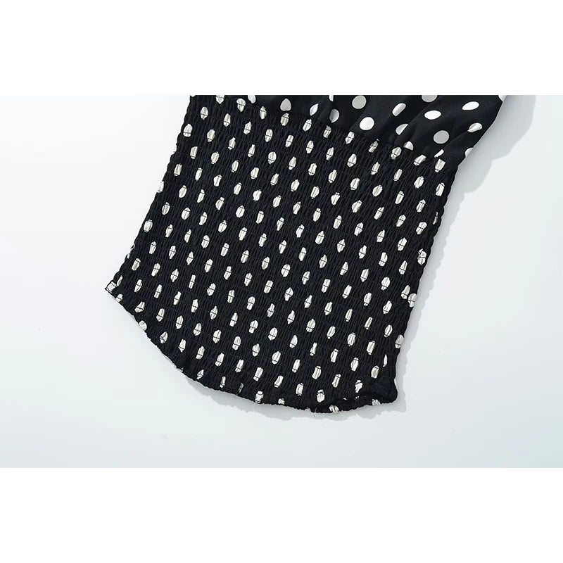 black::Black fabric with white polka dot pattern on a white background