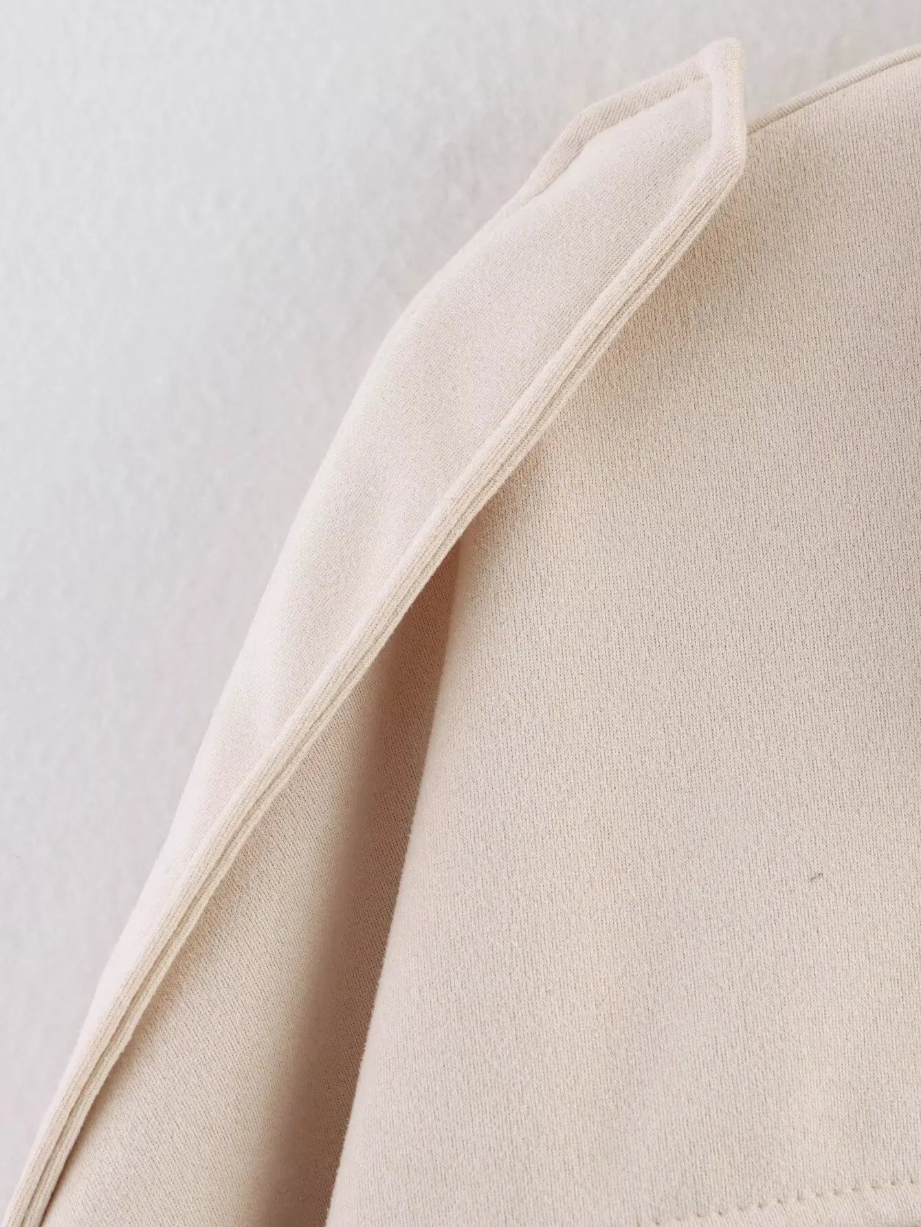 allvariant::Close-up of beige fabric with a light background