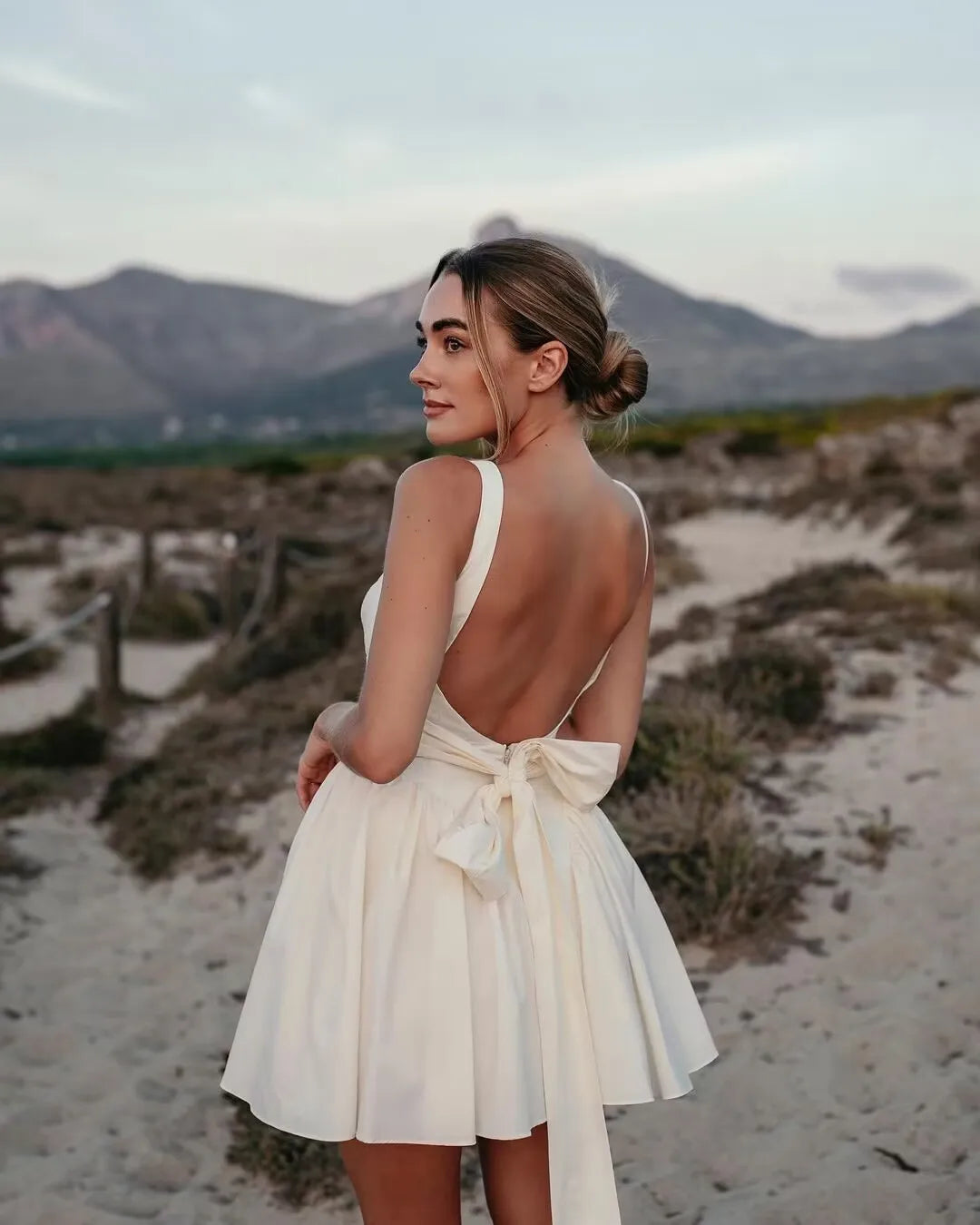 Backless Tie-Bow Pleated Mini Dress