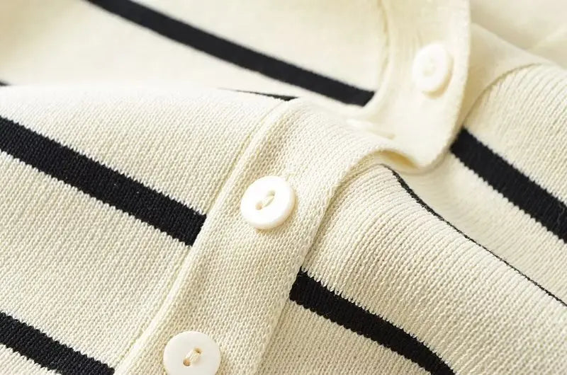 Striped::Close-up of a striped sweater with buttons