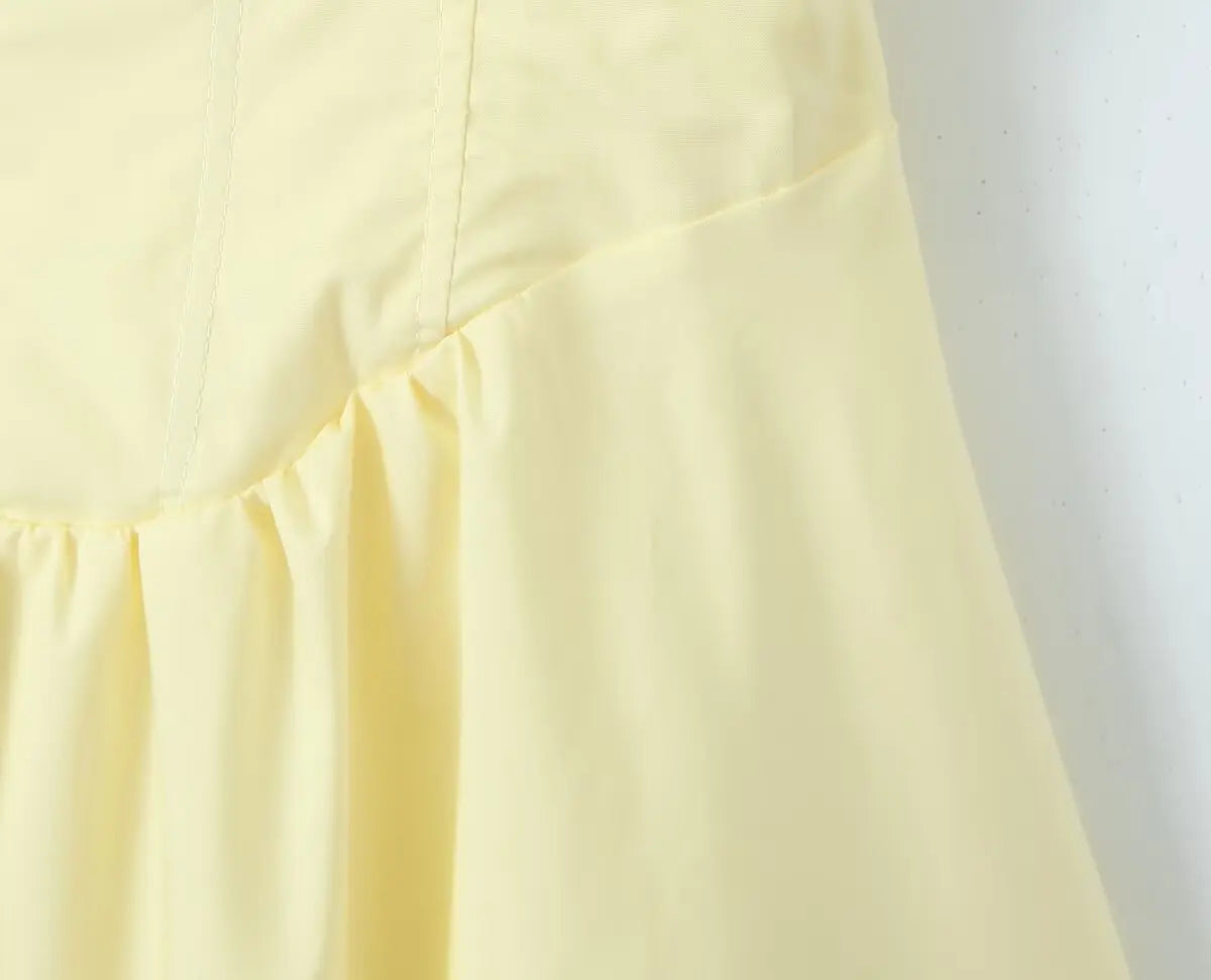 allvariant::Close-up of a light yellow fabric with a subtle pattern on a white background