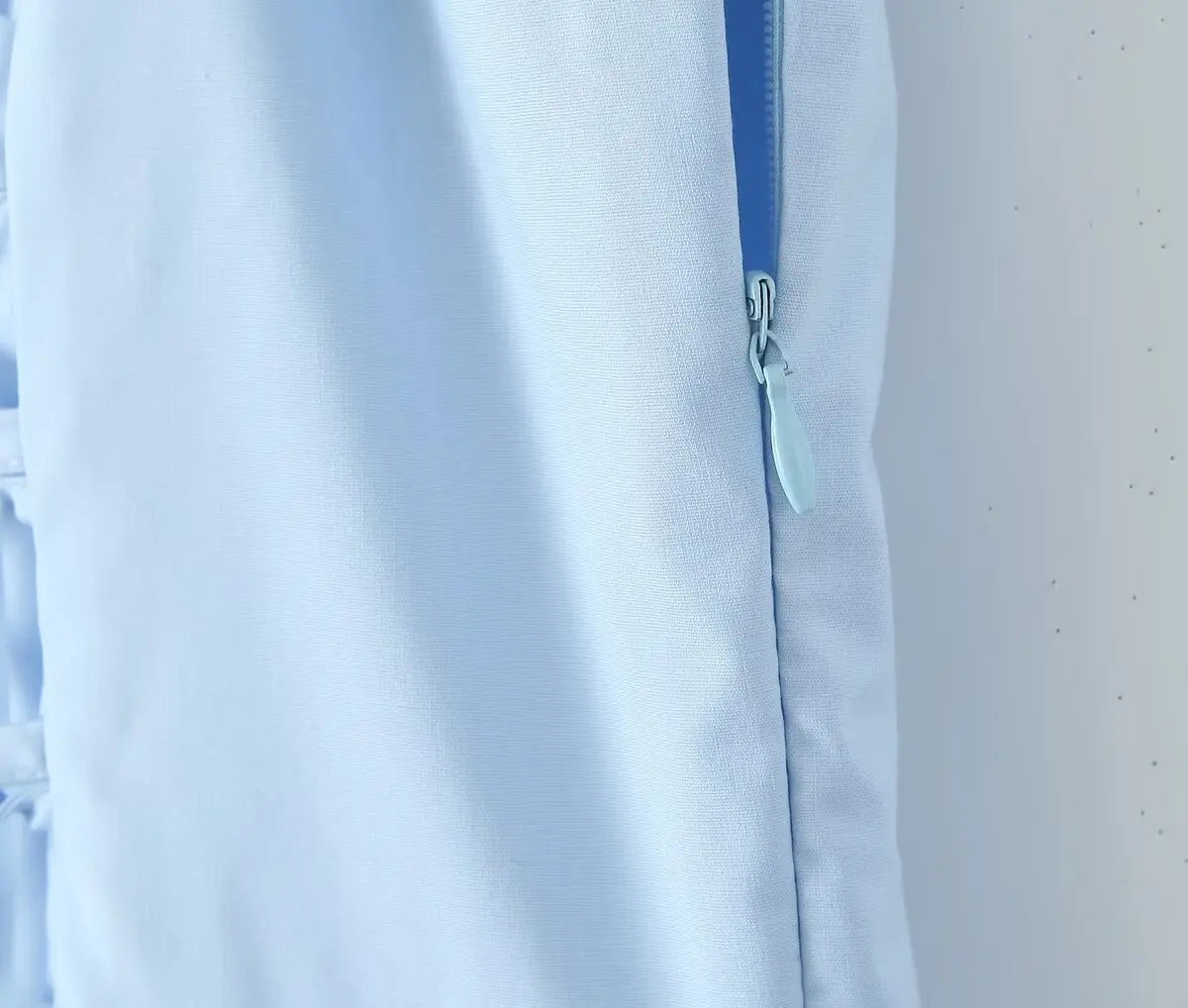allvariant::Light blue shirt with a zipper on a white background