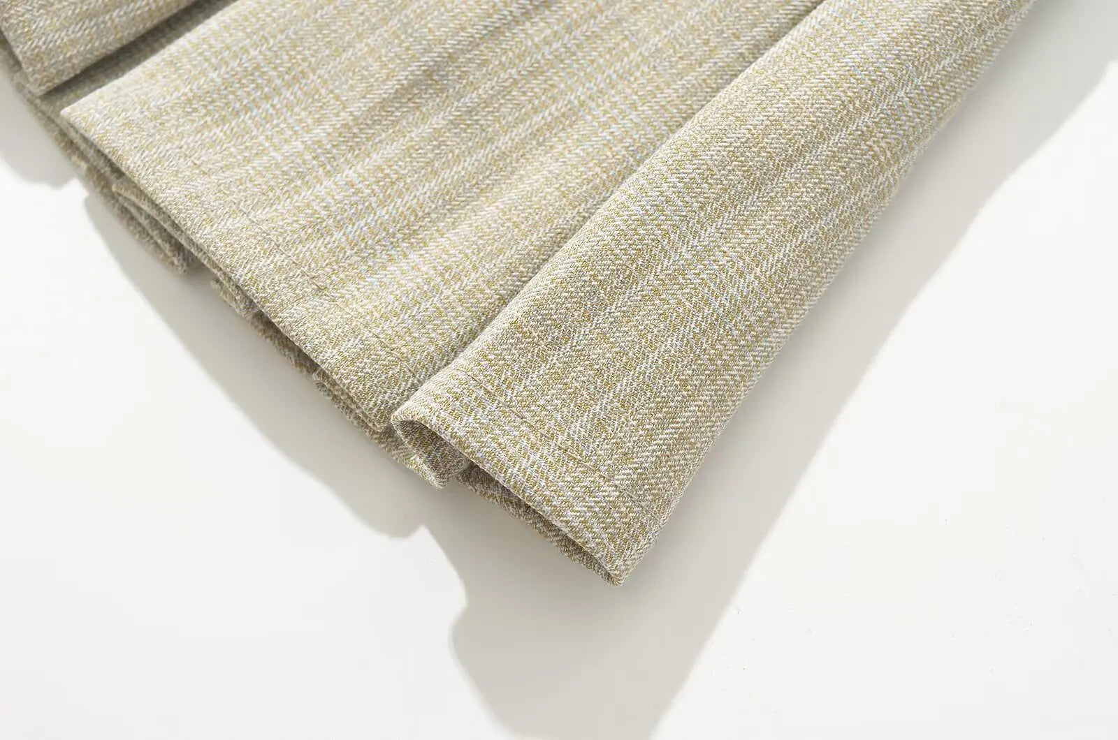 allvariant::Textured beige fabric roll on a white background