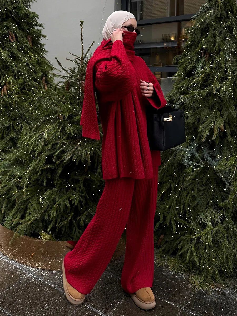 Red:: Person in a red outfit standing outdoors with greenery in the background
