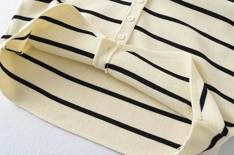 Striped::Close-up of a striped shirt with black and white horizontal lines on a light background