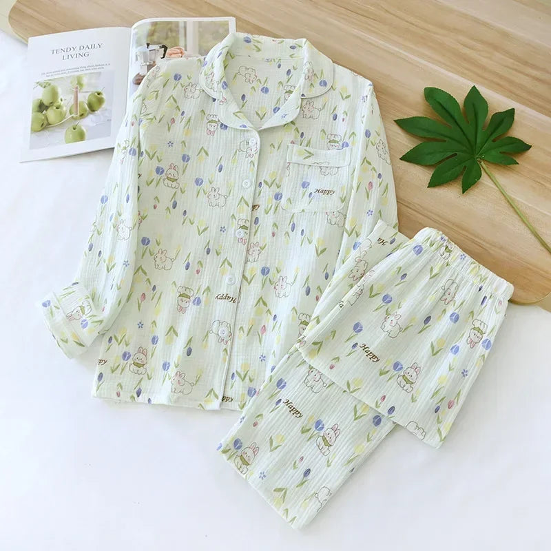 allvariants:: Floral pajama set on a white surface with a magazine and leaf decoration.