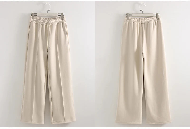 allvariants:: Beige wide-leg pants on hangers against a white background