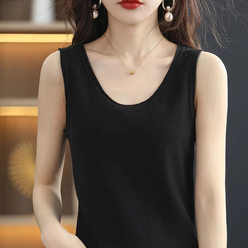 allvariants:: Woman wearing a black sleeveless top with a blurred background