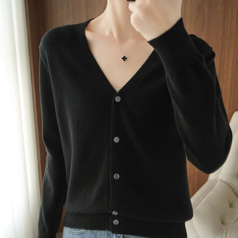 allvariants:: Person wearing a black cardigan with a blurred background