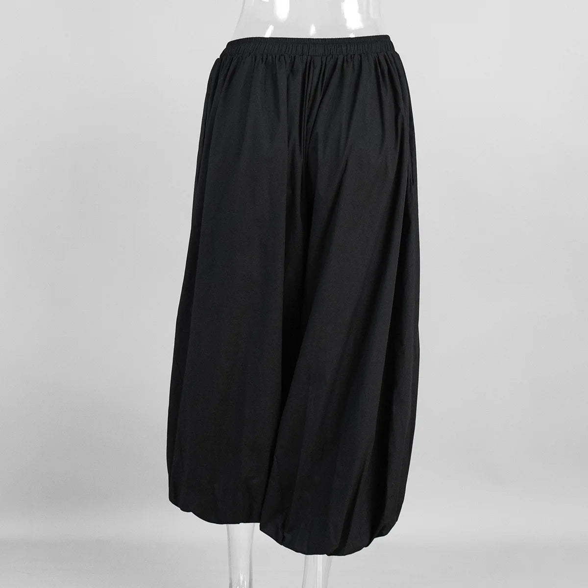 Black:: wide-leg pants on a mannequin against a white background