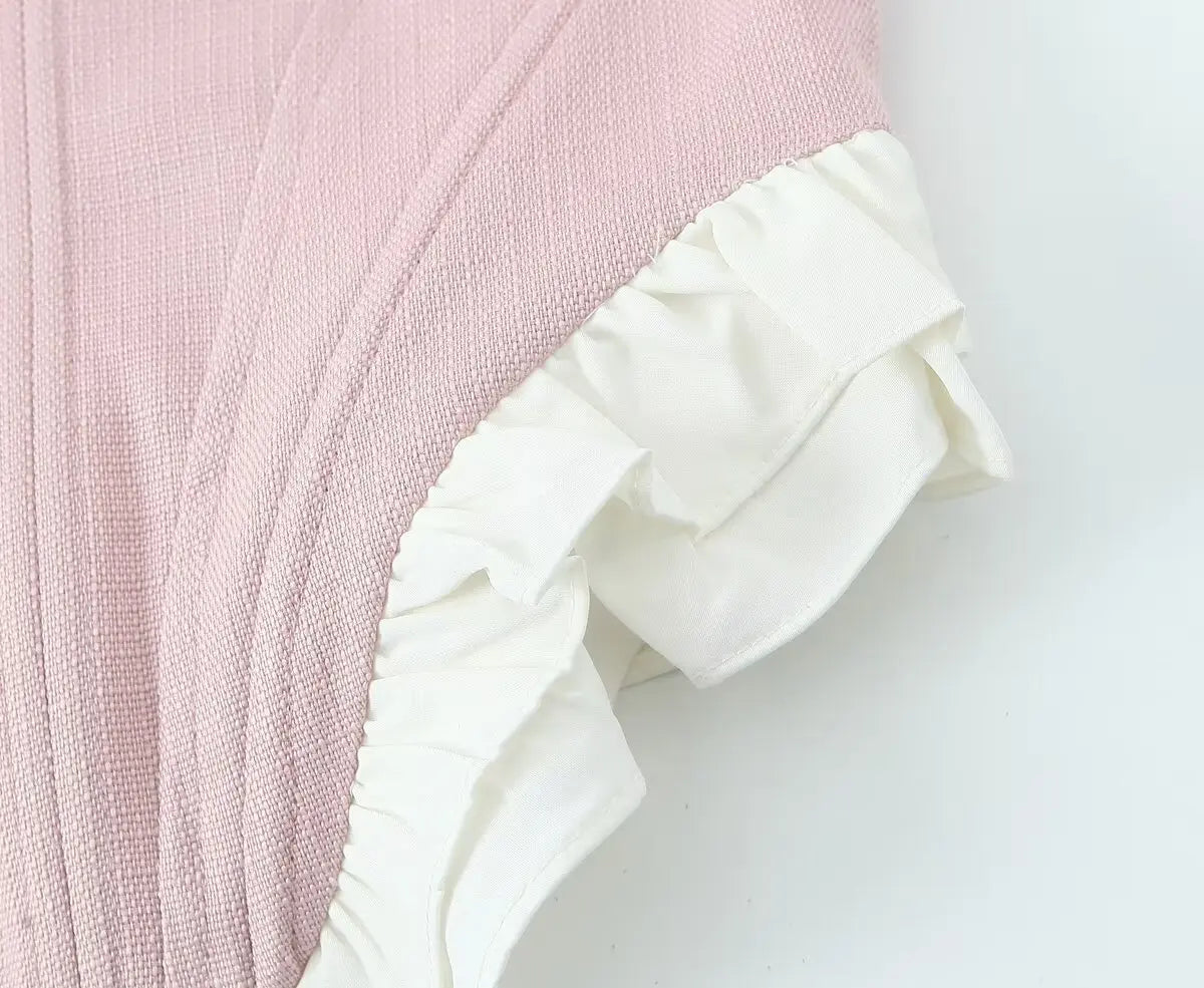 pink::Pink fabric with white ruffle trim on a white background