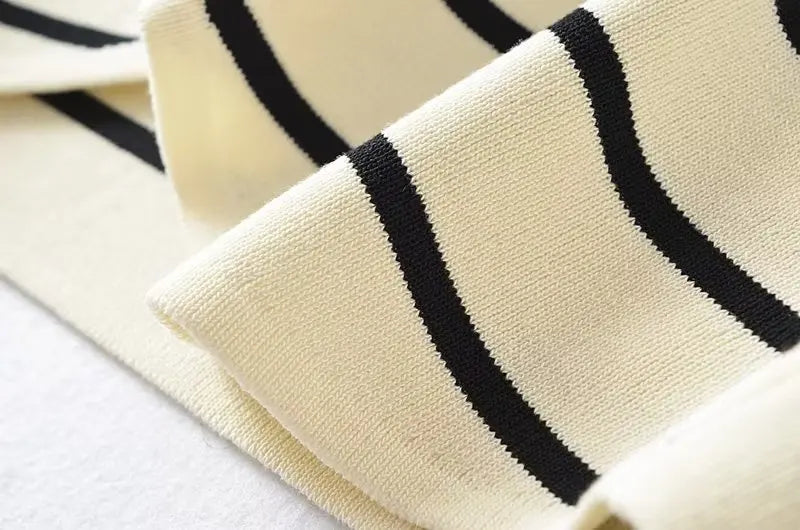 Striped::Close-up of beige fabric with black stripes on a white background