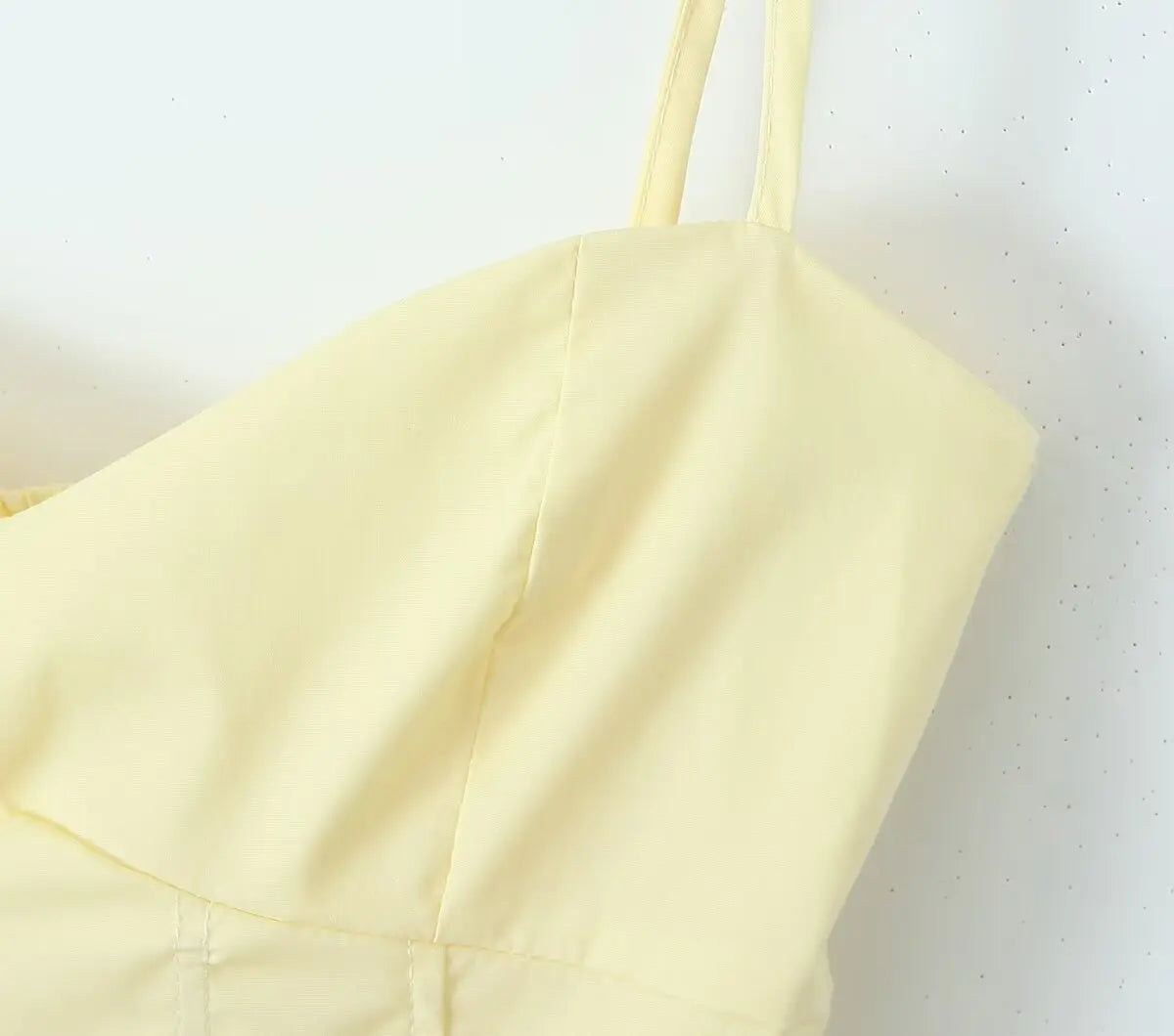 allvariant::Light yellow dress with thin straps on a white background