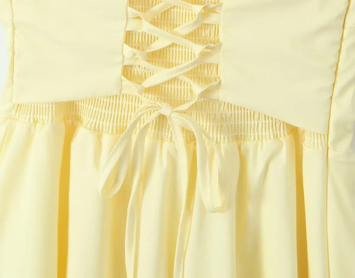 allvariant::Yellow dress with lace-up front detail on a light yellow background