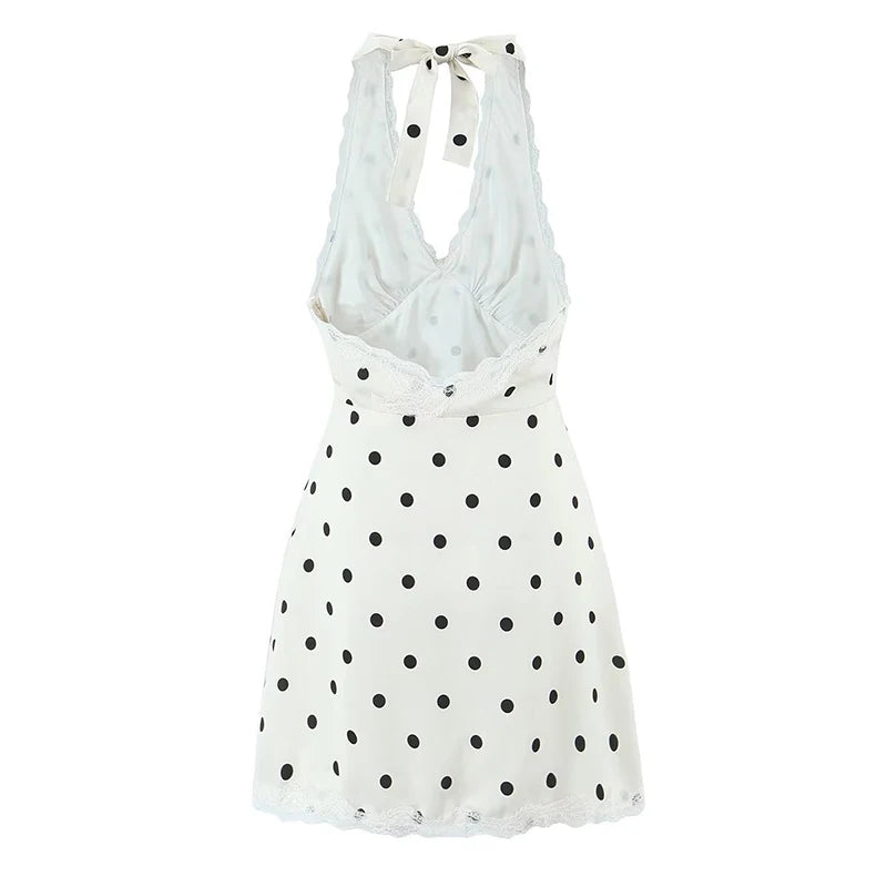 White:: dress with black polka dots on a white background