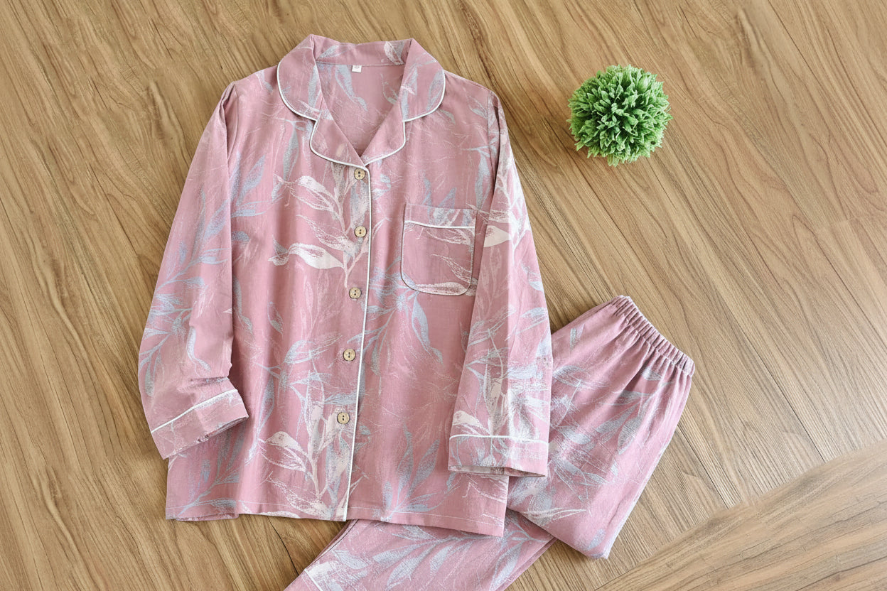allvariants:: Pink pajama set with floral pattern on a wooden surface