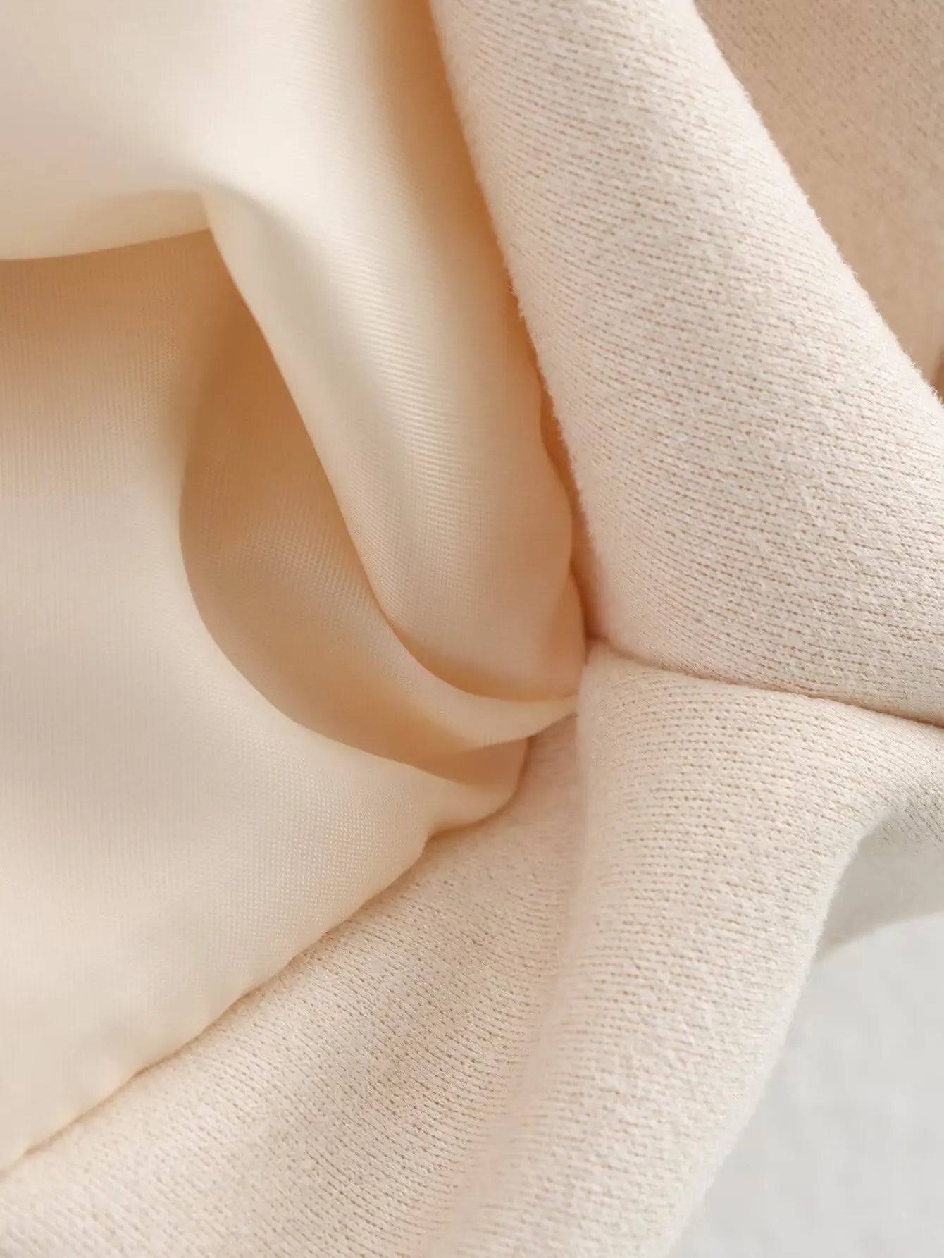allvariant::Close-up of beige fabric with a soft texture