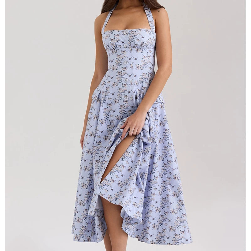 light blue::Woman wearing a floral dress with a slit on a plain background